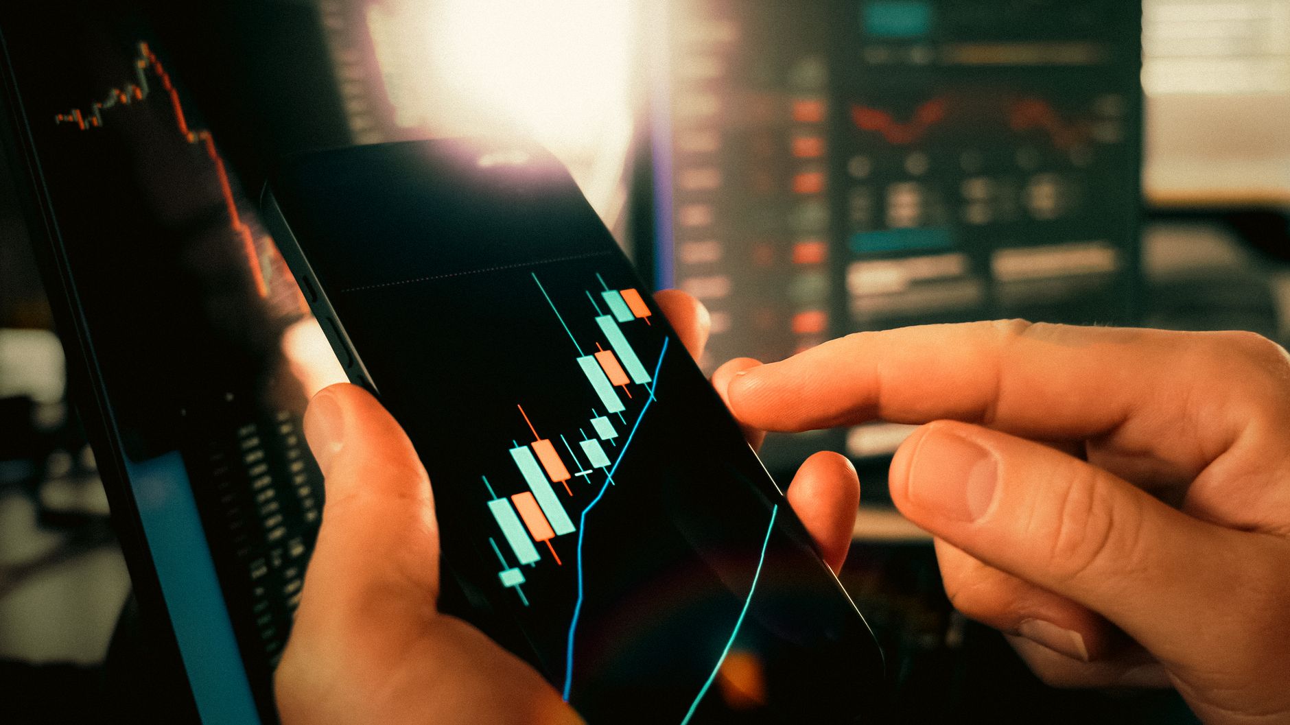 A Wall Street trading floor screen showing falling technology stock prices in red