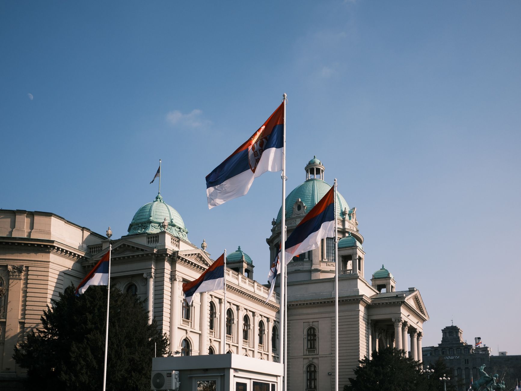 Voters lining up outside a polling station in Belgrade during Serbia's early parliamentary election