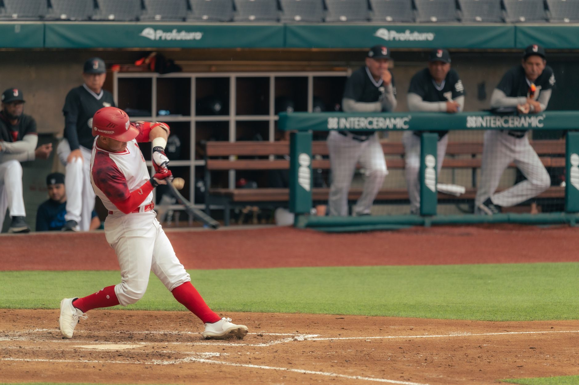 Young baseball outfielder in Brewers uniform mid-swing during a World Series night game
