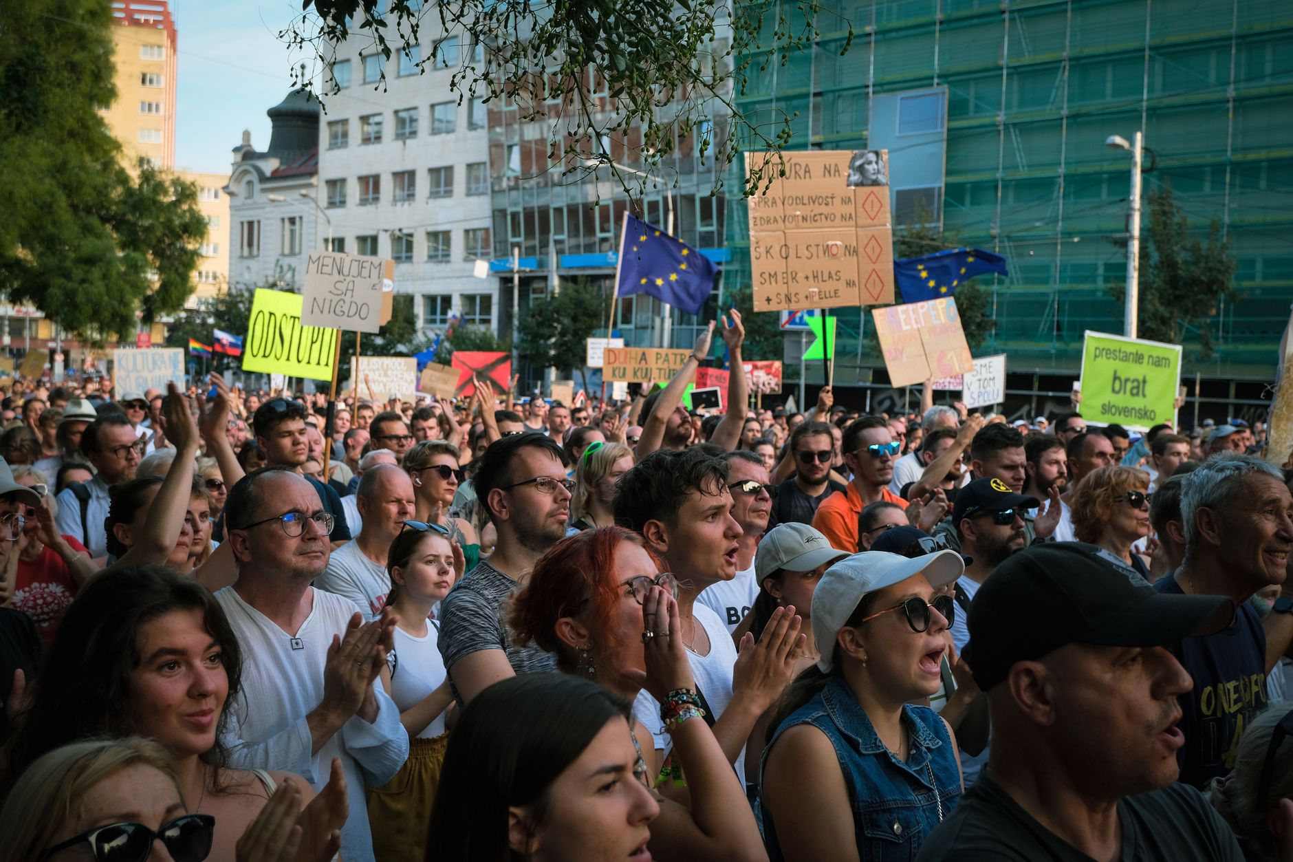 Crowds celebrate outside a government building in Belgrade following election results