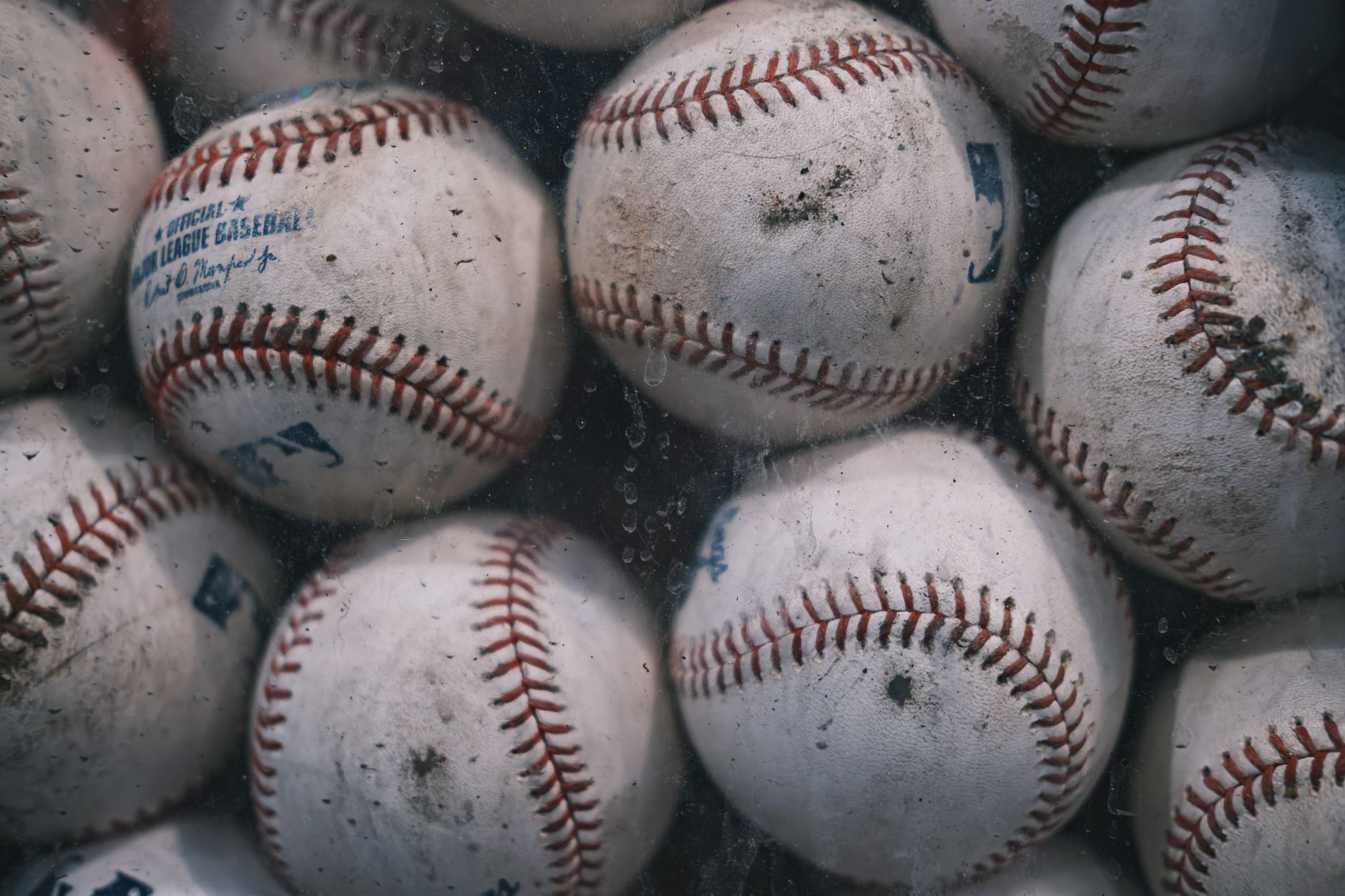 Baseball players reacting on the field after a walk-off hit under stadium lights