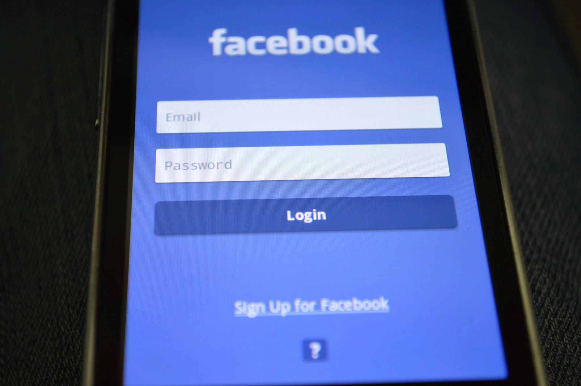 Smartphone displaying a restaurant app login screen next to a padlock icon symbolizing a data security flaw