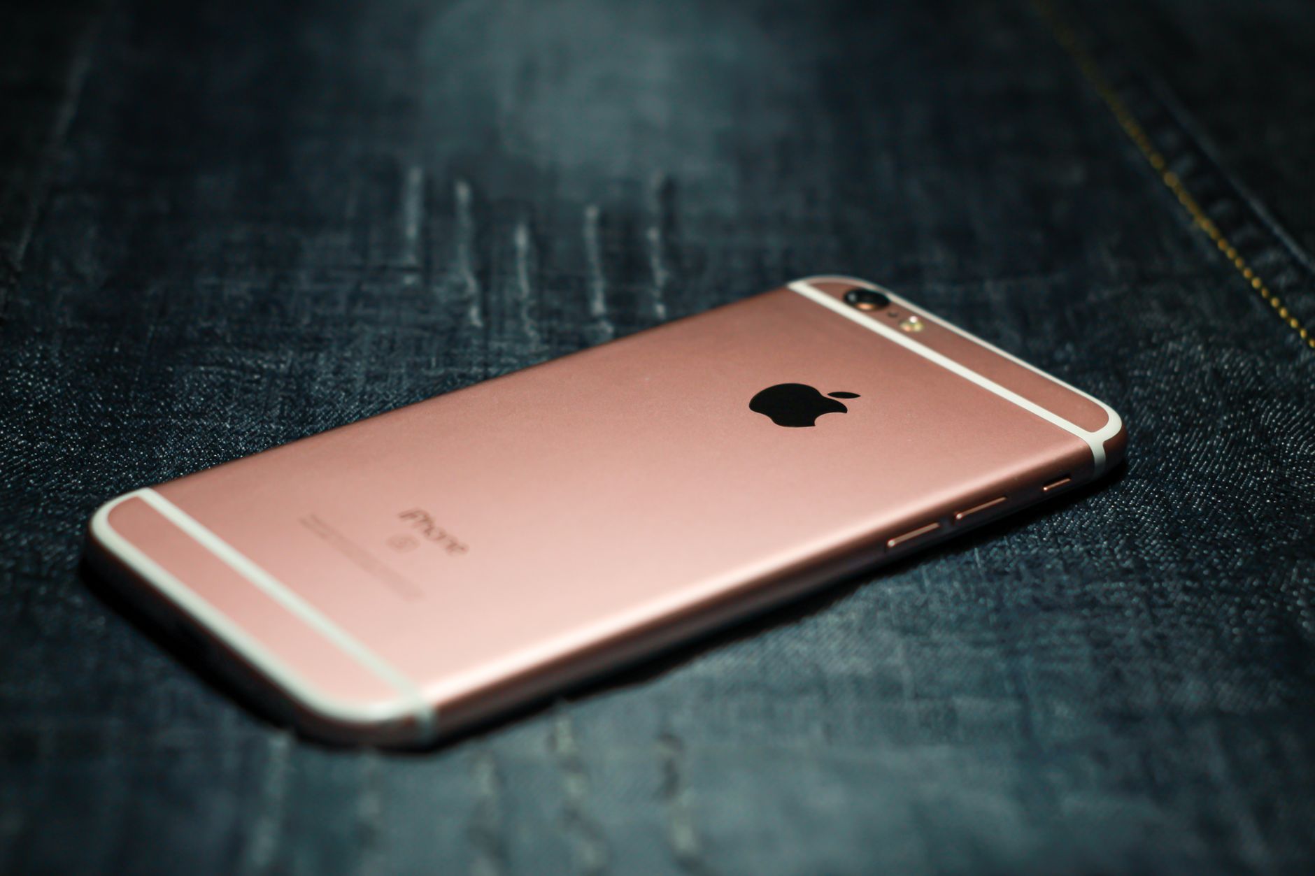 Close-up of a folded dual-screen smartphone showing a cracked inner display with a visible line across the glass