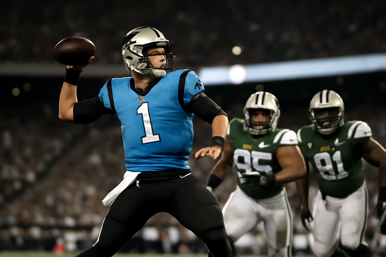 Carolina Panthers quarterback throwing a pass against Philadelphia Eagles defenders during a Week 6 NFL game