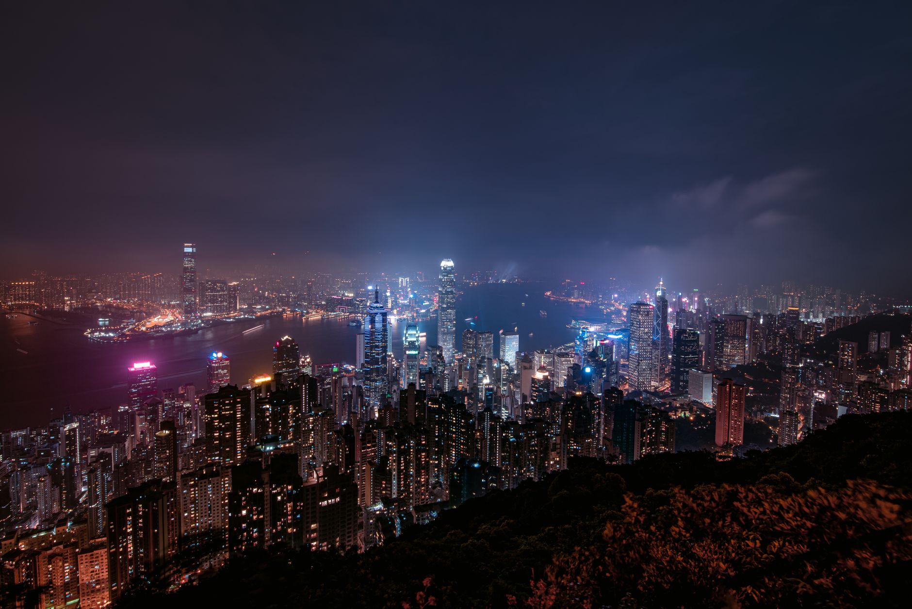 Burned high-rise apartment towers with scorched scaffolding in Hong Kong's Tai Po district