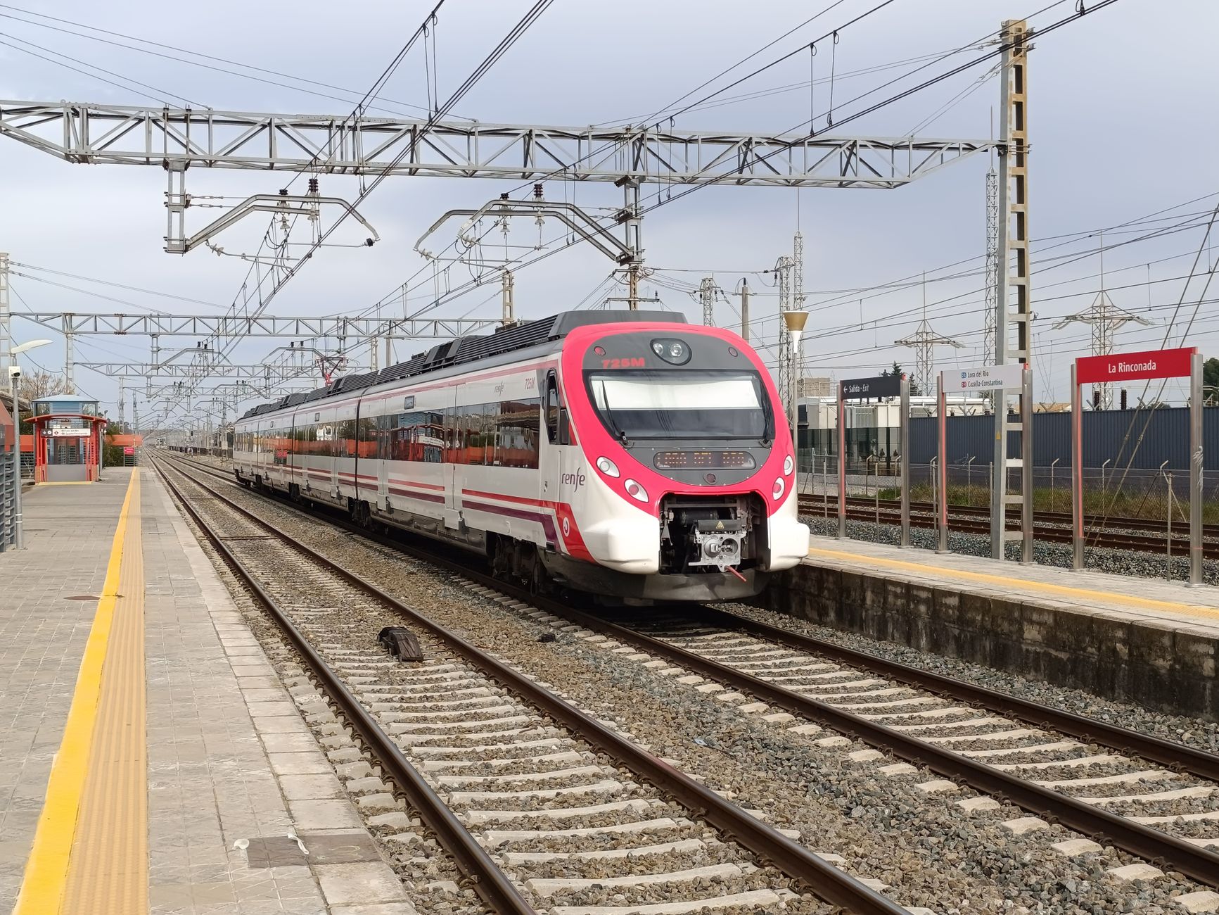 Emergency crews and damaged rail cars along a Spanish train line after a collision
