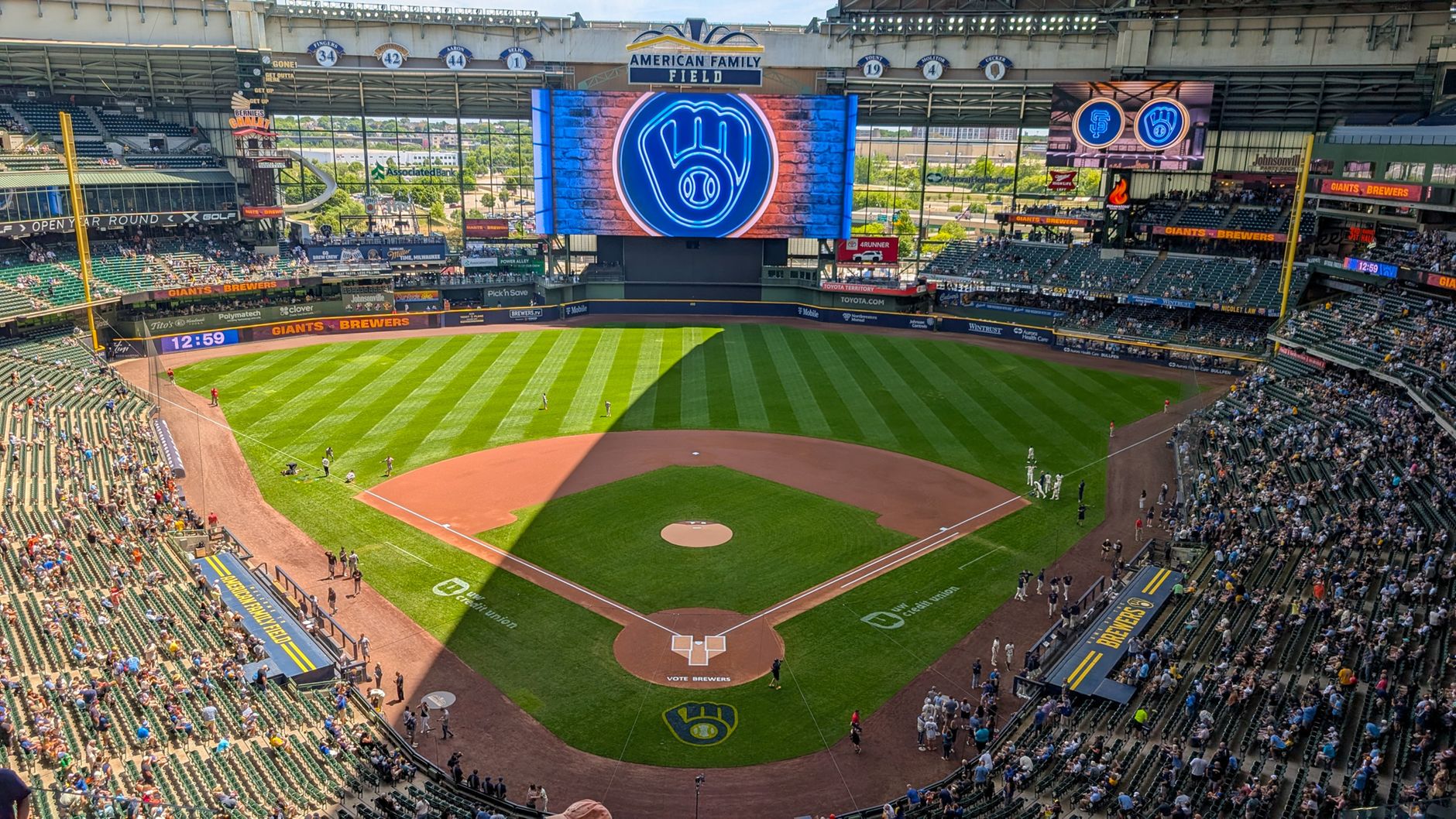 Baseball stadium lit for a night World Series game with fans in the stands