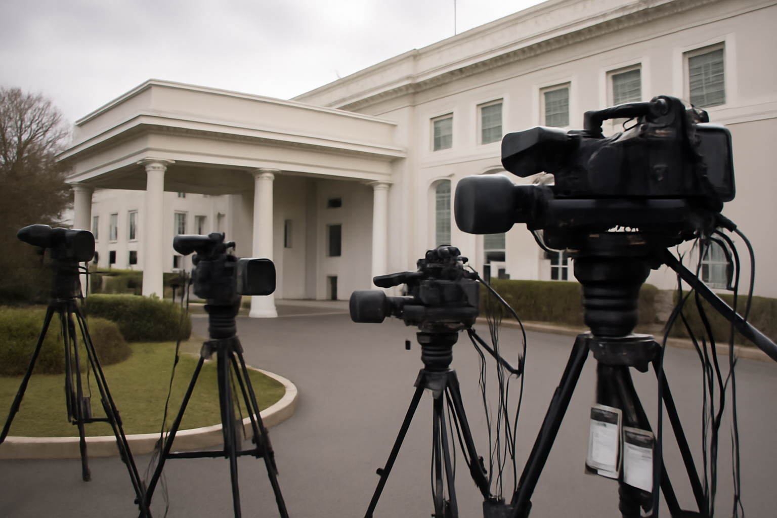 Television news cameras and White House press credentials set up outside the West Wing briefing room