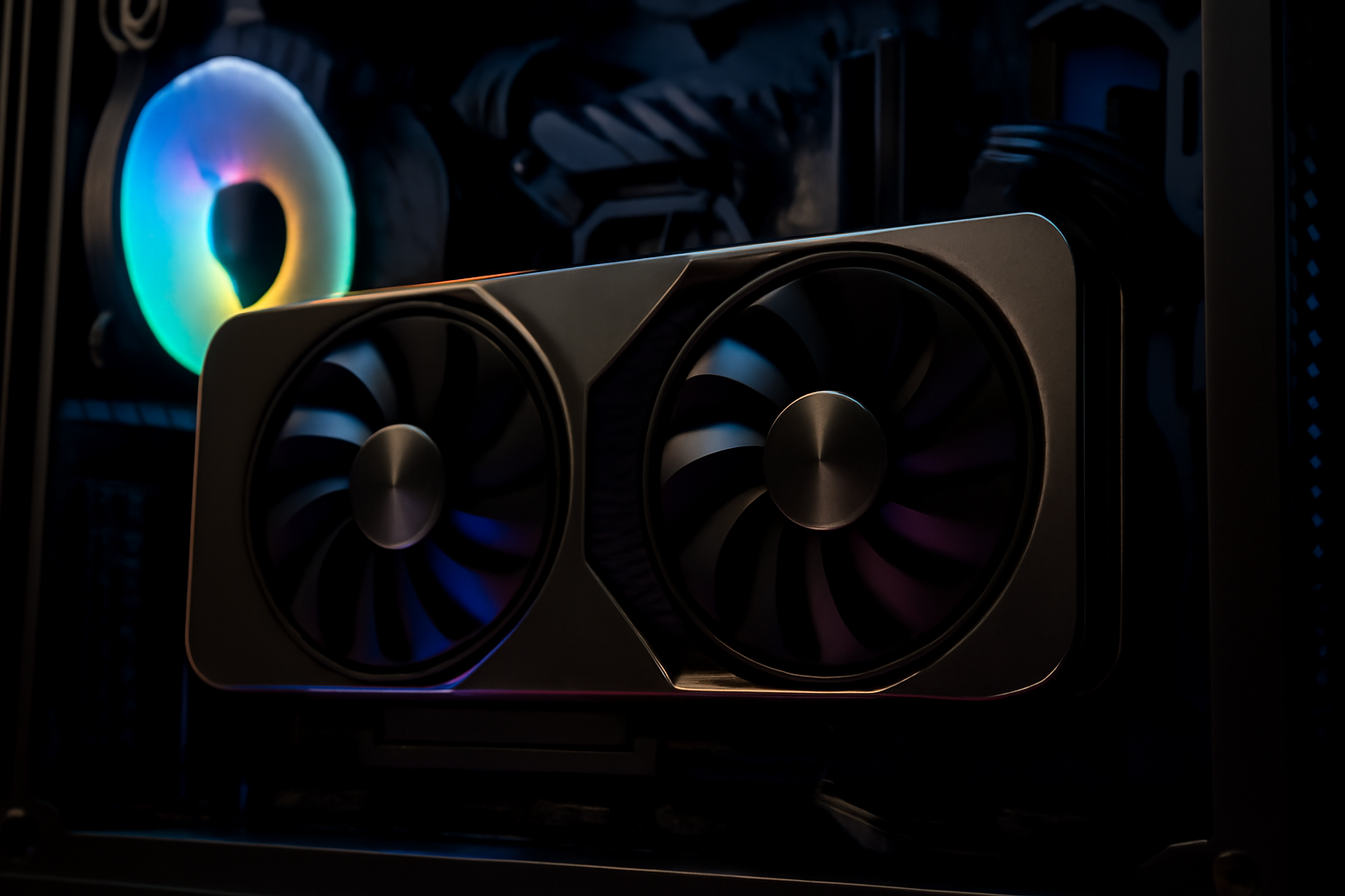 Close-up of an Nvidia graphics card installed in a gaming PC with RGB lighting