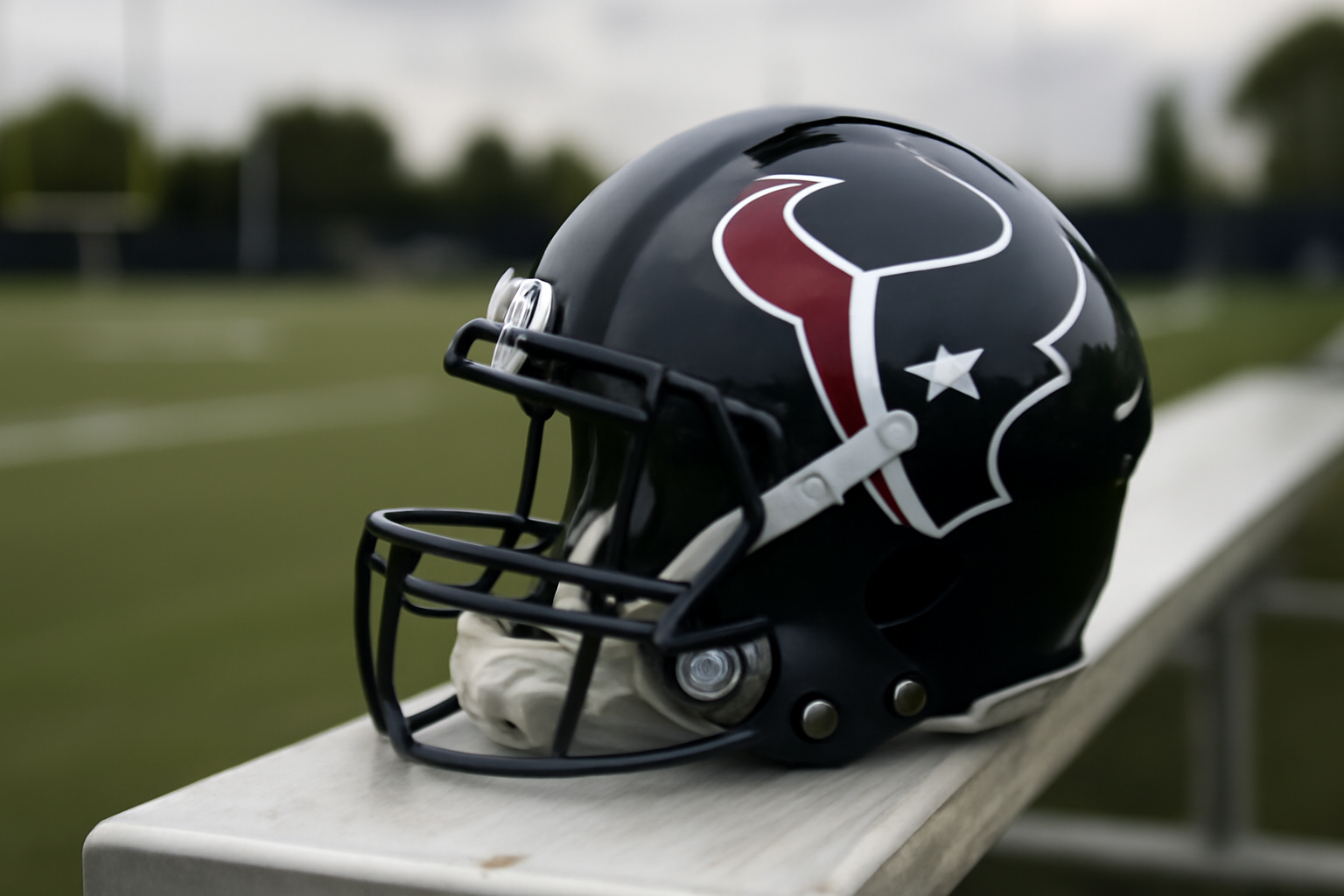 Houston Texans helmet and jersey on a practice field sideline