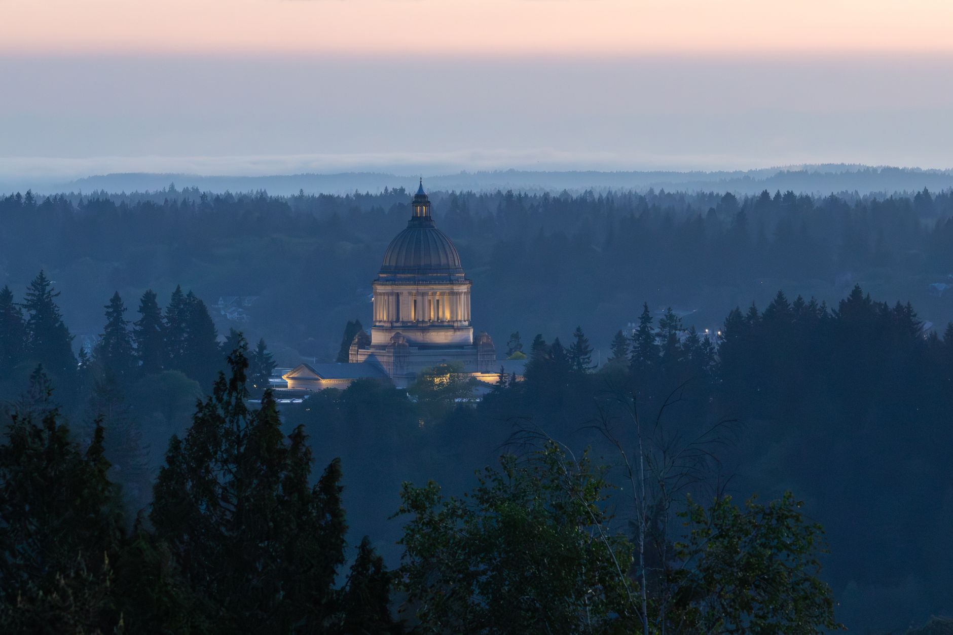 Alaska state capitol building exterior under overcast sky