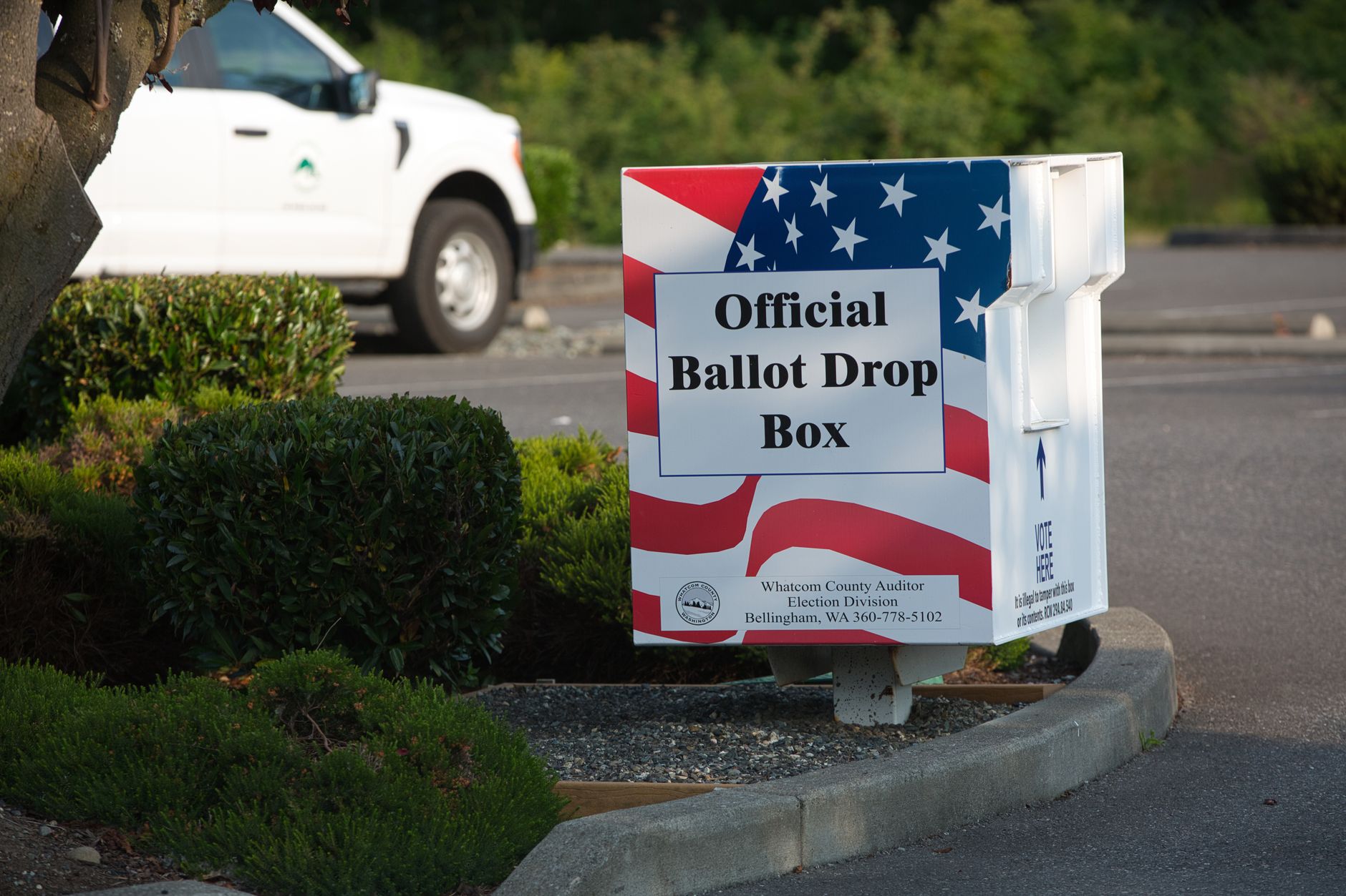 Exterior of a California county elections office building with an American flag