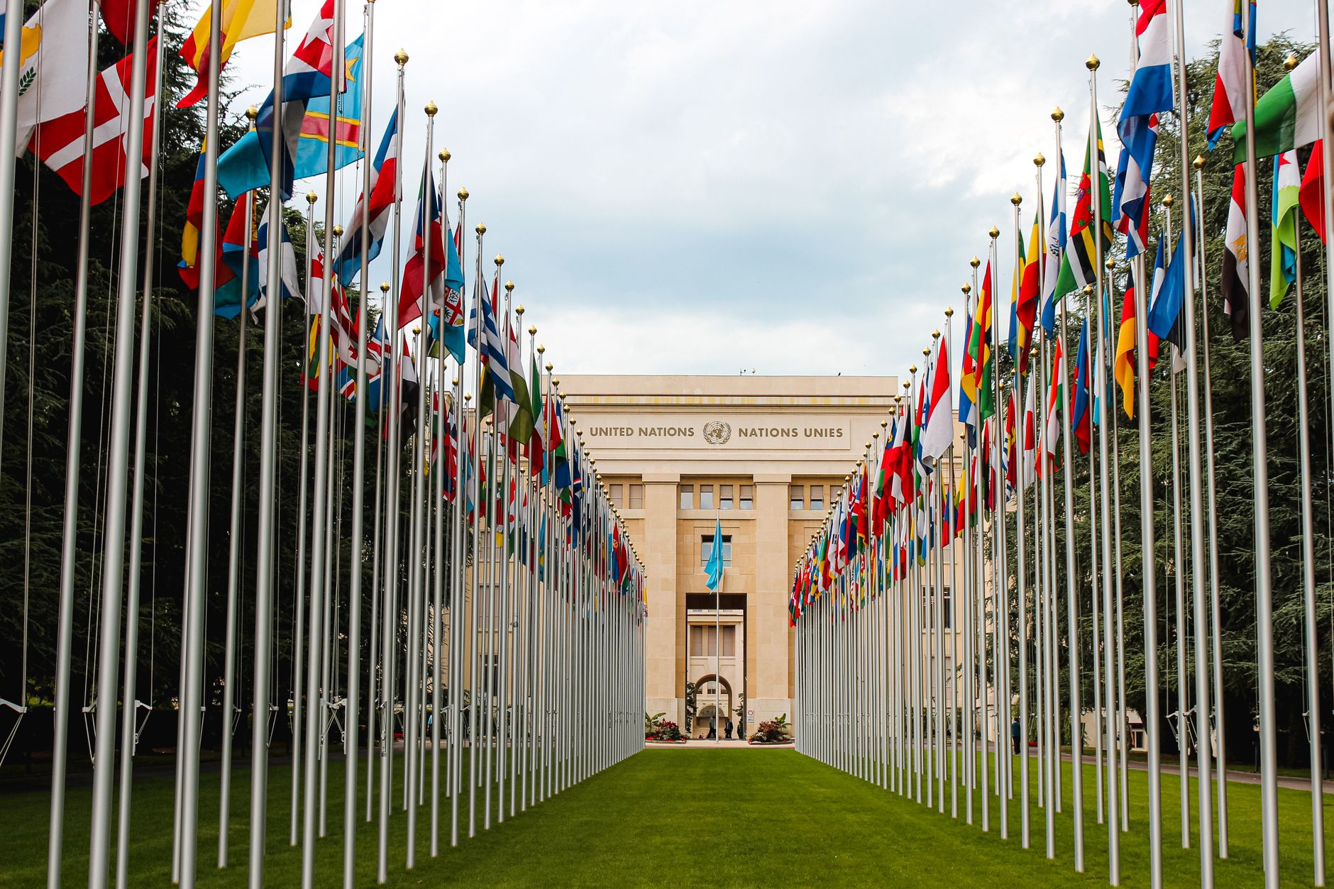 Flags of G20 member nations displayed outside a conference center in the United States