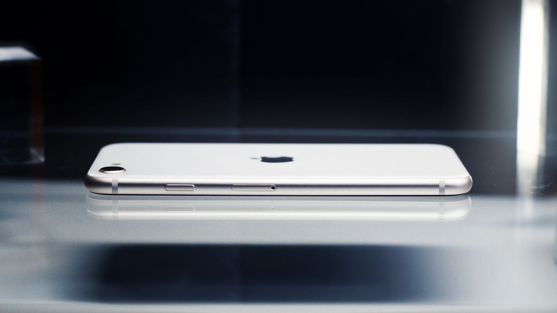 A folded iPhone Duo resting next to its unfolded form on a wooden desk