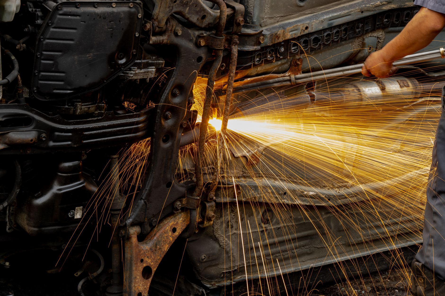 Steel coils and unfinished auto bodies sit on a factory floor near the Canada-U.S. border