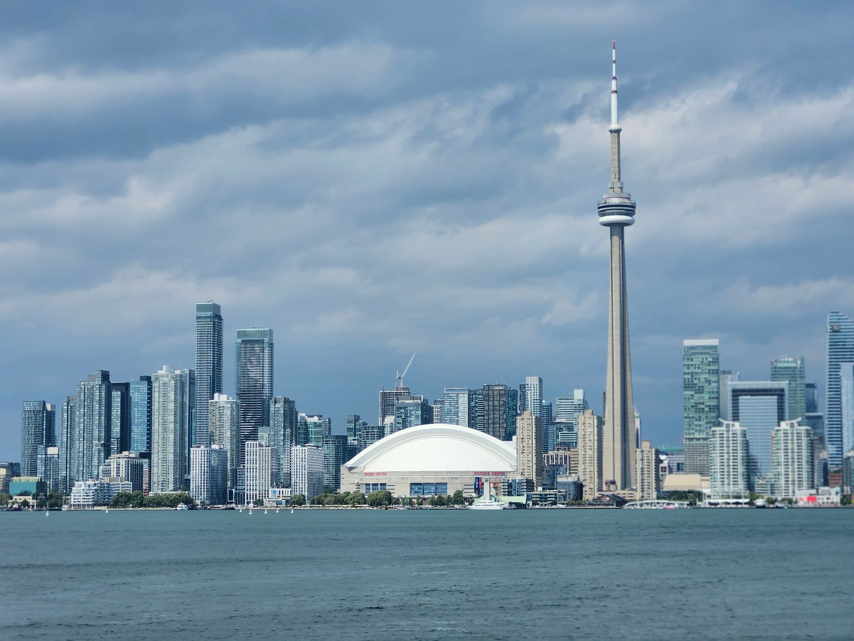 Sunset over Lake Ontario shoreline with Toronto skyline in the distance