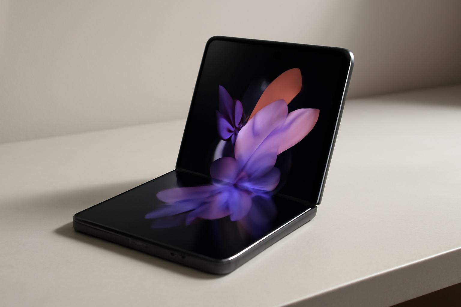 A folded smartphone with a visible hinge sits open on a desk showing a large interior display