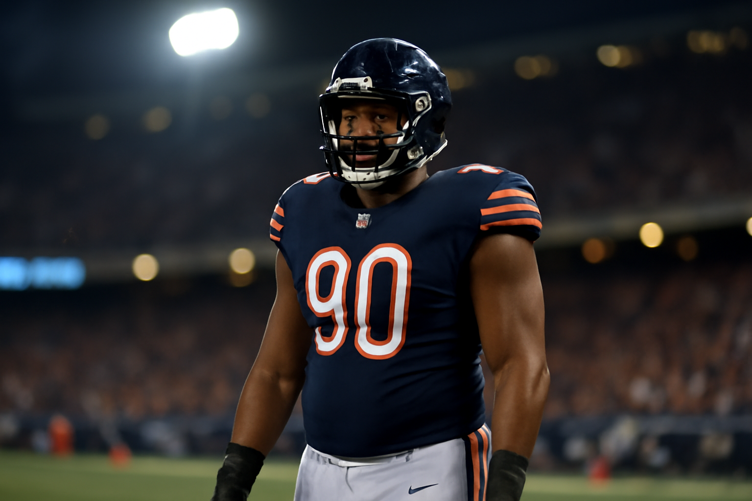 Chicago Bears defensive lineman in uniform standing on the sideline during an NFL game