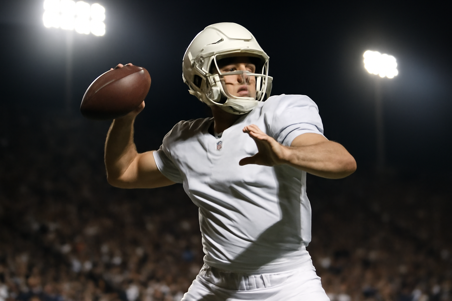 College football quarterback dropping back to pass during a night game under stadium lights