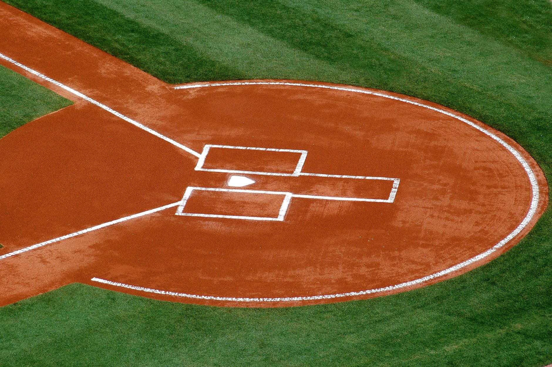 A baseball player watches a ball he just hit during a late-night World Series game at a domed stadium