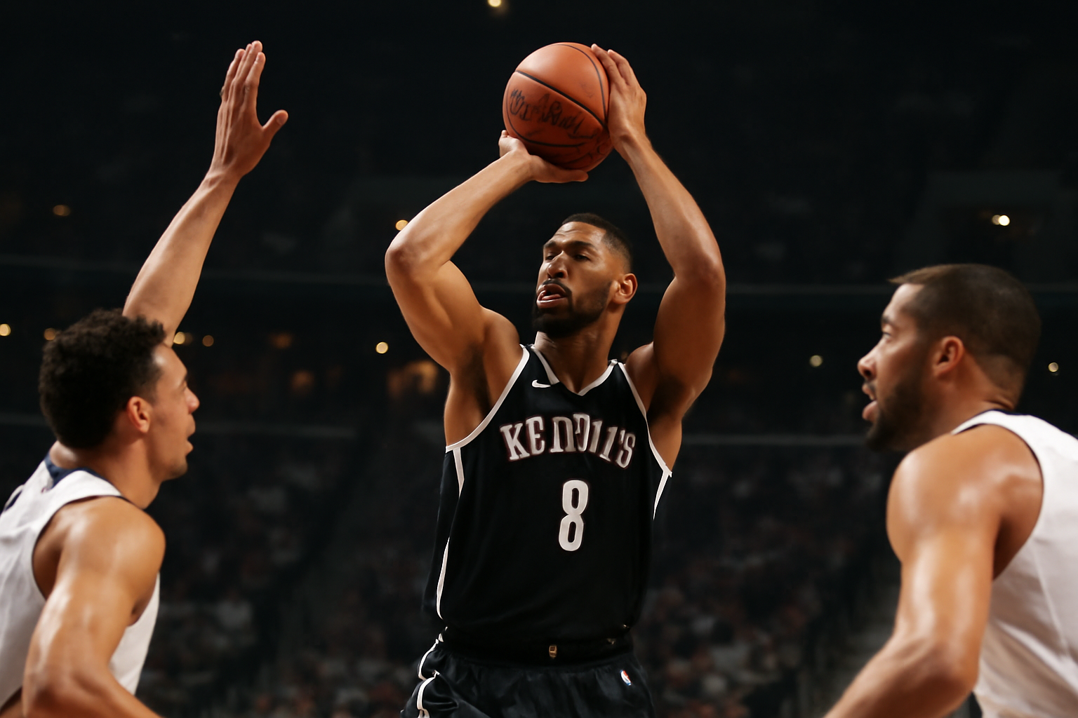 Julius Randle in a Brooklyn Nets jersey shooting during a preseason basketball game