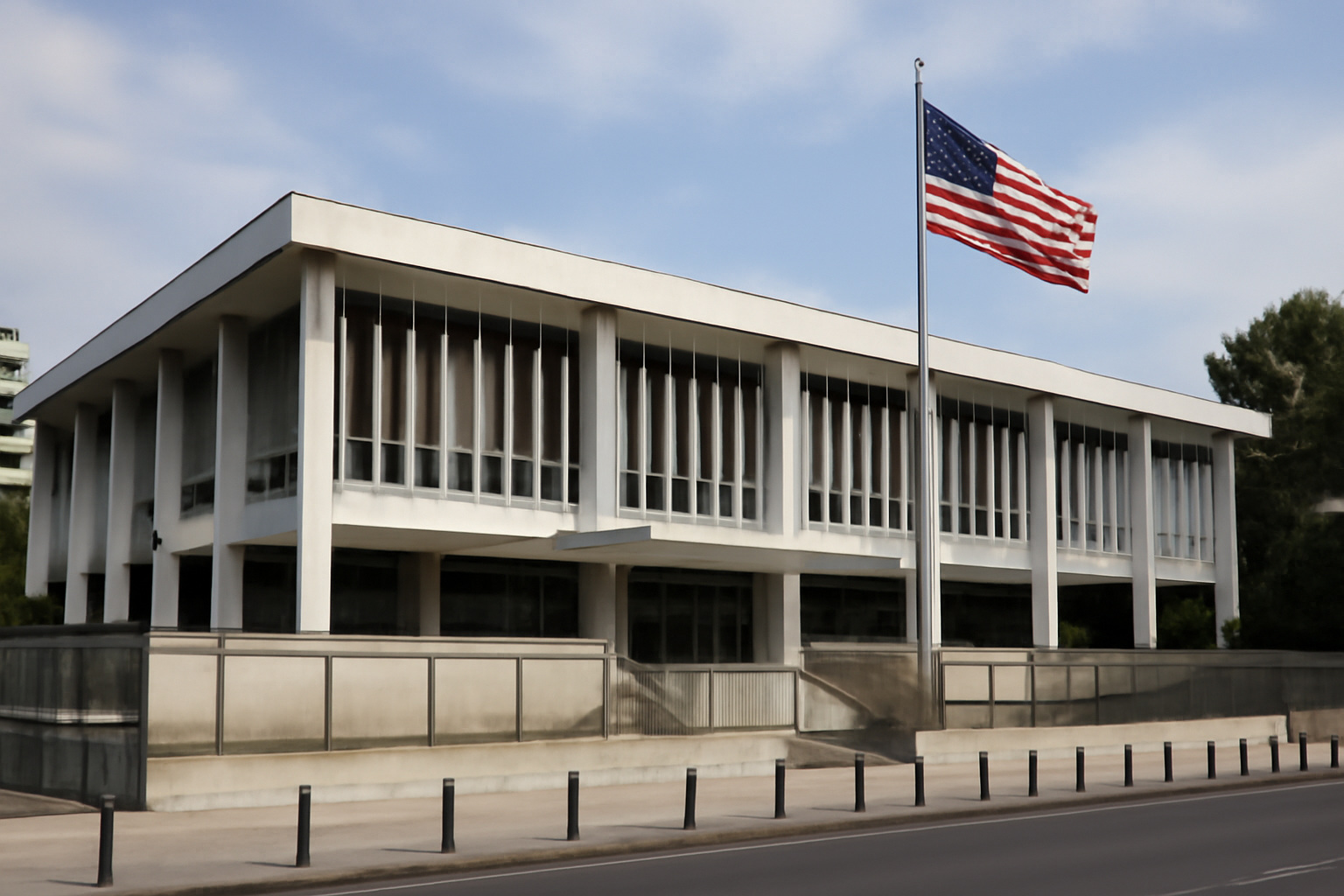 The flag-draped entrance of the United States Embassy building in Athens, Greece