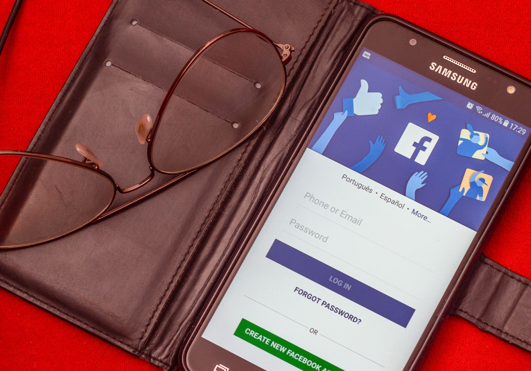 Smartphone screen showing a Facebook Page post with a hyperlink icon and a lock symbol