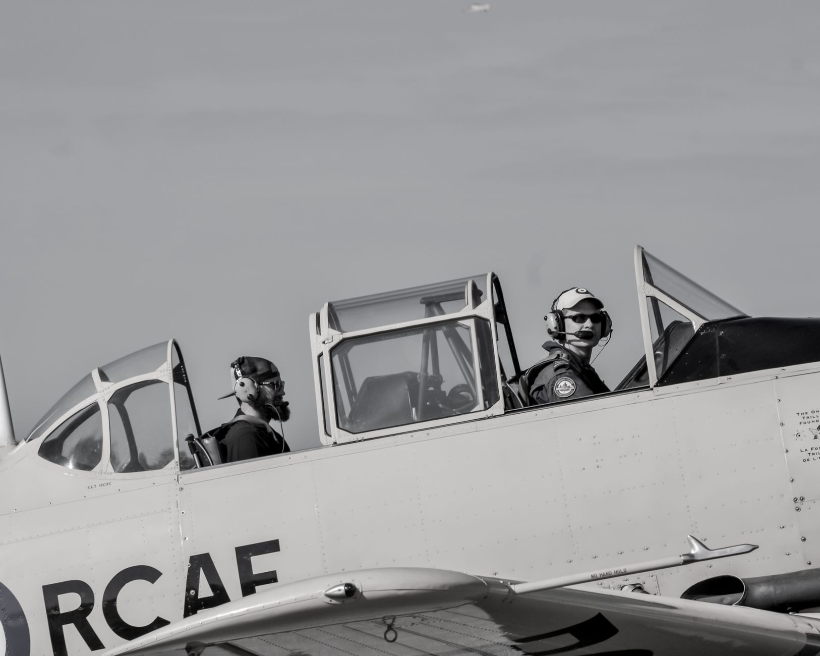 Philippine Air Force training aircraft parked on an airbase tarmac under overcast sky