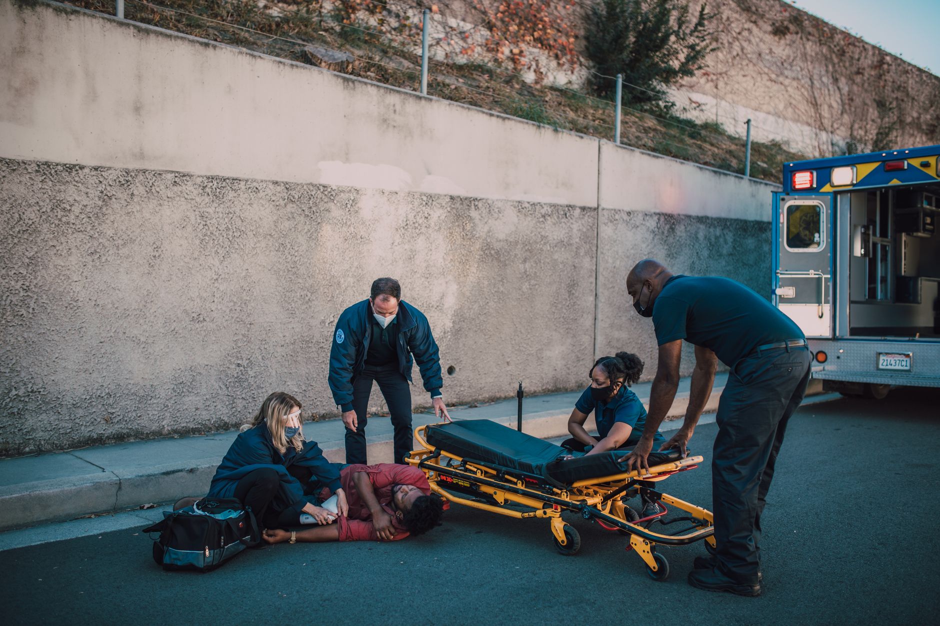 NBA medical staff attending to a player on a stretcher courtside during a game